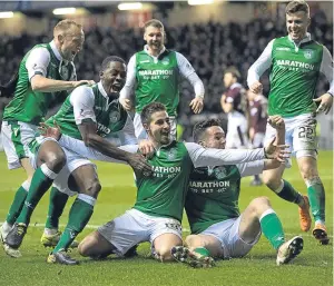  ?? Picture: SNS. ?? Jamie Maclaren celebrates his goal with team-mates.
