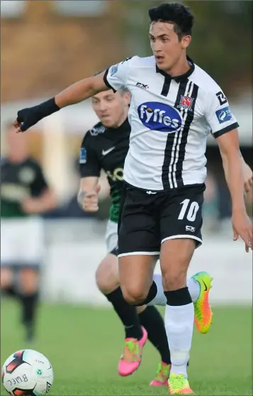  ??  ?? Jamie McGrath of Dundalk is tracked by Gary McCabe of Bray Wanderers during Friday evening’s SSE Airtricity League Premier Division match at the Carlisle Grounds.