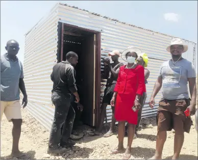  ?? Photo: Loide Jason ?? Seeking solution… Mayor Fransina Kahungu (in red) pictured with some committee members who had approved Luusa Andreas to erect her shack due to her medical condition.