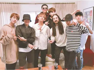  ??  ?? BTS and DJ Steve Aoki. — Courtesy of Steve Aoki through Twitter