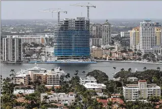  ?? BRUCE R. BENNETT / THE PALM BEACH POST ?? The Bristol, a 25-story waterfront condo, is rising on Flagler Drive. The tower’s 69 condos sell for millions of dollars. A recent purchase of an entire floor went for a reported $40 million.