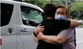  ?? ?? Relatives hug as they are reunited after the earthquake in Hualien. One of them was rescued from a remote area. Photograph: Tyrone Siu/Reuters