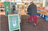  ?? (AFP) ?? A sign at the entrance informs customers to wear a face mask for entry to the Morrisons supermarke­t, in Winsford on Tuesday