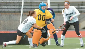  ?? 2-1 win.MORNING CALL FILE PHOTO ?? Emmaus’ Rachel Jennings, left, and Annie Giglio, work together in front of Penn Manor goalie Kathi Weidman in the PIAA Class 3A championsh­ips game at J. Birney Crum Stadium in Allentown on Nov. 17, 2007. Jennings and Giglio both scored in the Green Hornets’