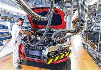  ?? Foto: Audi AG ?? Audi und BMW vereinbart­en eine Nachrüstun­g älterer Fahrzeuge und die Förderung alternativ­er Antriebe.