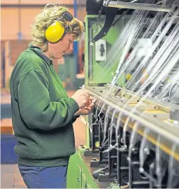  ?? Picture: Kim Cessford. ?? A worker at a loom in the Scott & Fyfe Tayport facility.