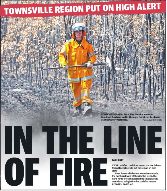  ?? Picture: ZAK SIMMONDS ?? SCORCHED EARTH: Rural Fire Service member Monique Davision walks through burnt- out bushland at Bluewater yesterday.