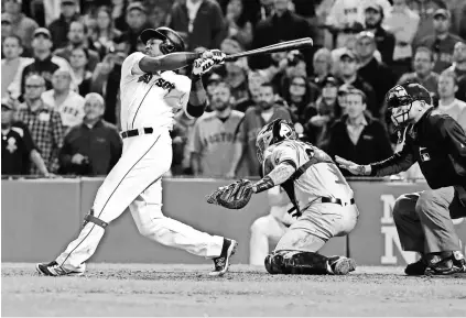  ?? DAVID BUTLER II, USA TODAY SPORTS ?? Red Sox first baseman Hanley Ramirez follows through on a three-run homer in the ninth inning that beat the Yankees on Sept. 15 at Fenway Park, kicking off Boston’s four-game sweep.
