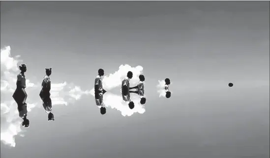  ?? Jeannette Ehlers ?? DANISH TRINIDADIA­N artist Jeannette Ehlers’ video “Black Bullets, 2012” shows black figures disappeari­ng into a liquidy horizon as they walk down a staircase.