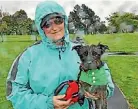  ??  ?? Even on a miserable wet day, Val Jenness enjoys walking Teddy.