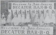  ?? File Photo ?? The Miss Decatur Barbecue contestant­s appear on stage during the third annual Decatur Barbecue on Aug. 2, 1956.