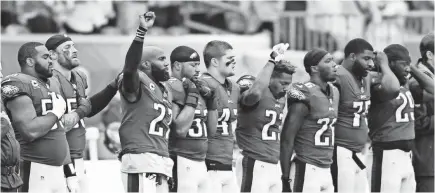  ??  ?? Philadelph­ia’s Malcolm Jenkins (27) and safety Rodney McLeod raise their fists during the national anthem last Sunday. JAMES LANG, USA TODAY SPORTS