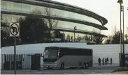  ?? Mason Trinca / Special to The Chronicle ?? Employees wait for the shuttle buses at Apple Park in Cupertino. The buses have added to area traffic.