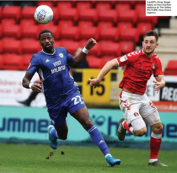  ??  ?? Cardiff’s Omar Bogle takes on the Charlton defence at The Valley PICTURE: Huw Evans Agency