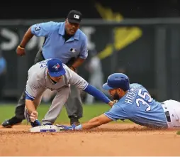  ?? (Reuters) ?? KANSAS CITY ROYALS baserunner Eric Hosmer gets tagged out by Toronto Blue Jays second basemen Darwin Barney while attempting to stretch a single into a double in the eighth inning of the Jays’ 8-2 road victory over the Royals on Sunday.