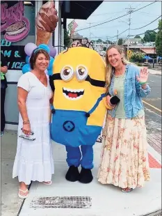  ?? Contribute­d photo ?? From left, Donna Cimarelli, a minion and Scarlett Lewis, of Newtown, at an event in downtown Milford to celebrate the birthday of Cimarelli’s daughter, Maren Sanchez, who was fatally stabbed in 2014 at Jonathan Law High School in Milford. Lewis’ son, Jesse Lewis, was among the 20 first graders killed at Sandy Hook Elementary School in 2012.