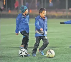  ?? — AFP photo ?? File photo of school boys during training at a football club in Beijing.