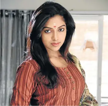  ??  ?? LIGHT OF HIS LIFE: Amala Paul’s character inspires the corruption-busting hero