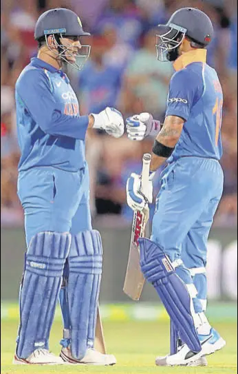  ?? AP ?? Kohli, who scored his 39th ODI ton, featured in a 82-run stand with Dhoni (55* off 54 balls) to help India seal a six-wicket win in Adelaide on Tuesday. The third and final ODI is at MCG on Friday.
