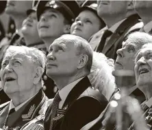  ?? Handout / Host Photo Agency via Getty Images ?? Russian President Vladimir Putin watches a flyover during Wednesday’s celebratio­n in Red Square.