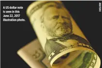 ??  ?? A US dollar note is seen in this June 22, 2017 illustrati­on photo.