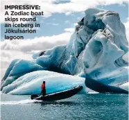 ??  ?? IMPRESSIVE: A Zodiac boat skips round an iceberg in Jökulsárló­n lagoon
