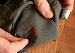  ?? ?? 3
Now do the same in reverse, passing needle and thread across your earlier stitches and through the same holes, creating the crosses.