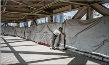  ?? LAM YIK FEI / THE NEW YORK TIMES ?? Constructi­on begins on a terminal serving a planned 85-mile express rail line that will connect Hong Kong with Shenzhen and Guangzhou.