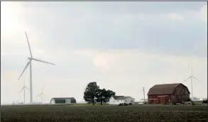  ?? AP/ JOHN FLESHER ?? Wind turbines can be seen scattered across farmland in December near Port Austin, Mich., one of the areas across the U. S. where the American Bird Conservanc­y says the rapid growth of wind energy is putting migratory birds at risk.