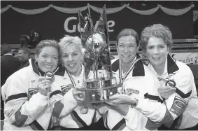  ?? JACK MIKRUT/AFP/Getty Images files ?? Curling was more sociable when Canadian women’s curling team, from left, Colleen Jones,
Kim Kelly, Mary-Anne Arsenault and Nancy Delahunt won the 2004 world title.
