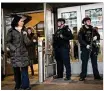  ?? GETTY IMAGES ?? Members of the New York City Police Department stand guard during the morning rush hour at an entrance to New York Port Authority Bus Terminal on Tuesday.