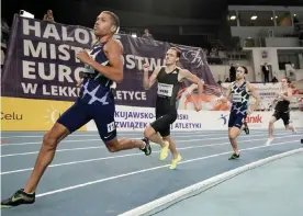  ??  ?? The British runner Elliot Giles (left) on his way to running the second-fastest indoor 800m in history in Torun, Poland. Photograph: Aleksandra Szmigiel/Reuters