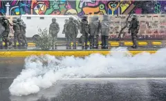  ?? AFP ?? Riot policemen are seen during a protest in Santiago, Chile on Sunday.