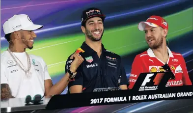  ?? Picture: TRACEY NEARMY, EPA ?? THE JOKE’S ON YOU MATE: Lewis Hamilton, Daniel Ricciardo and Sebastian Vettel share a laugh during a press conference in Melbourne yesterday.