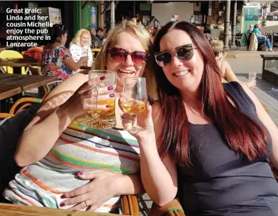  ??  ?? Great craic: Linda and her cousin Michelle enjoy the pub atmosphere in Lanzarote
