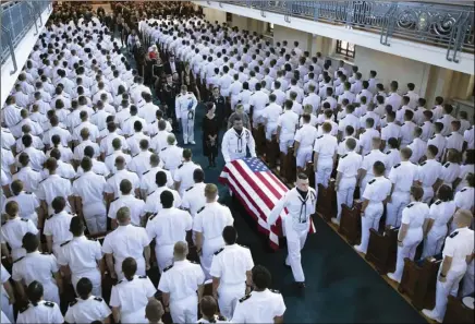  ?? DAVID HUME KENNERLY/MCCAIN FAMILY VIA AP ?? In this image proved by the family of John McCain, the family follows as the casket of Sen. John McCain, R-Ariz., is moved from the Chapel on the grounds of the United States Navel Academy after a service on Sunday, in Annapolis, Md.