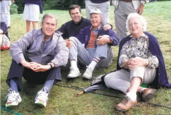  ?? John Mottern / AFP / Getty Images 1999 ?? Barbara Bush and son George W. (left), future president; son Jeb, governor of Florida; and husband George H.W., former president, watch Ryder Cup golf in Brookline, Mass., in 1999.