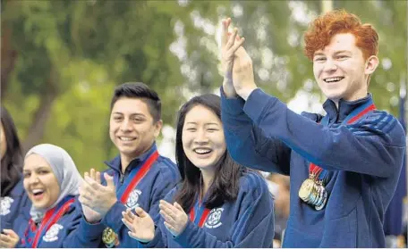  ?? Al Seib Los Angeles Times ?? NEELEM SHEIKH, from left, Jose Apolaya, Melissa Cheng, Rohan Boone were members of El Camino Real school’s 2014 academic decathlon-winning team. The Board of Education cites inappropri­ate spending and violations of public meeting rules at the school.