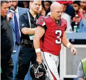  ?? CURTIS COMPTON / CCOMPTON@AJC.COM ?? Falcons kicker Matt Bryant leaves the game after kicking a key field goal Sunday. Bryant strained his hamstring and won’t play Monday.