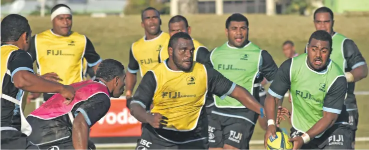  ?? Photo: Waisea Nasokia ?? Fiji Airways Drua Mesulame Dolokoto (with ball) on the attack while Luke Tagi closes in during training at Prince Charles Park in Nadi on August 16,2018.