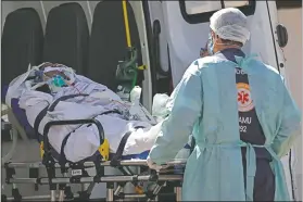  ?? (AP/Eraldo Peres) ?? A patient suspected of having covid-19 is received at the HRAN Hospital in Brasilia, Brazil.