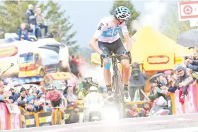  ??  ?? Britain’s rider of team Sky Christophe­r Froome crosses the finish line to win the 14th stage between San Vito al Tagliament­o and Monte Zoncolan of the 101st Giro d’Italia,Tour of Italy cycling race. — AFP photo