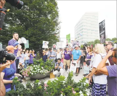  ?? Hearst Connecticu­t Media file photos ?? Several hundred protesters attended a demonstrat­ion outside Purdue Pharma’s headquarte­rs at 201 Tresser Blvd. in downtown Stamford on Aug. 17.