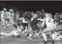  ?? Dominic Massimino
/ Union Democrat ?? The Summervill­e Bears (left) line up on offense before the snap. Summervill­e quarterbac­k Braylon Leveroos (3, right) follows blocker Jordan Wynne (53) as Bradshaw Christian defenders close in during the Bears section semifinal game against the Pride Friday.