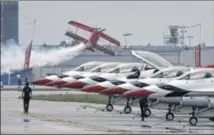  ?? TY GREENLEES / STAFF ?? Sean D. Tucker was the first flying act in a rain-delayed Dayton Air Show on Saturday.