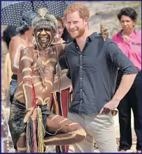  ??  ?? Harry poses with a member of the Butchulla people