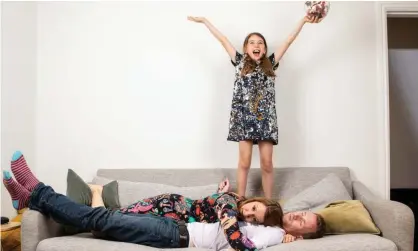  ?? ?? On top of the world: Flora, 9, making the most of being in charge of her parents, Donna and Neil. Photograph: Antonio Olmos/The Observer