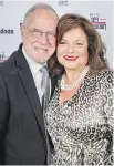  ??  ?? Cheek to chic: Event co-chair Etty Bienstock, right, and her husband Ralph wear big smiles (and cool prints) to the benefit event.