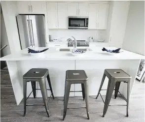  ??  ?? The kitchen in the Oakmont Townhomes show home. The developer, Slokker West, broke ground on the project in May 2016.