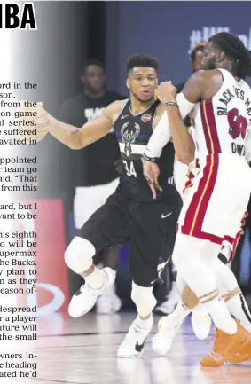  ?? (Photo: AFP) ?? Giannis Antetokoun­mpo (left) of the Milwaukee Bucks handles the ball during the game against the Miami Heat during game two of the Eastern Conference semifinals of the NBA play-offs on September 2, 2020 at Field House at ESPN Wide World Of Sports Complex in Orlando, Florida.